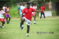 Samuel Inkoom  (in red) training