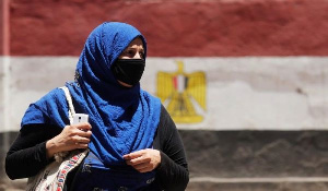 A woman wearing a protective face mask to prevent the spread of the coronavirus disease