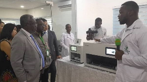 Dr Anthony Nsiah Asare (left) inspecting the equipment at the KOICA -KH lab