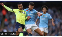 Southampton's Cameron Archer tussles for possession with Manchester City's Ruben Dias