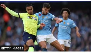 Southampton's Cameron Archer tussles for possession with Manchester City's Ruben Dias