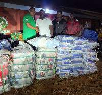 Isaac Ofori  Amoako presenting the items