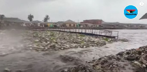 The broken bridge and rubbish floating on the water