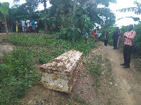 A photographer taking pictures of the coffin