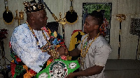 Isaac Dogboe (L) shaking hands with Torgbui Sri III