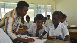 File photo: Random picture of students and a teacher in a class room.