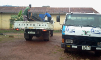 A staff packing his properties into a vehicle