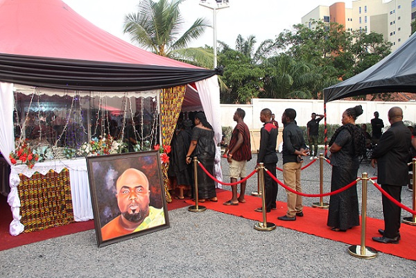 Family and friends file past KABA's remains