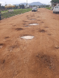 File photo; The several potholes developed on the Sunyani-Yawhima road are damaging vehicles