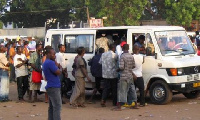 File photo: Passengers queuing to board a vehicle