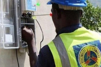 File Photo: An ECG worker installing a prepaid meter