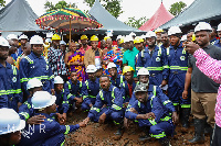 Some of the miners with the elders of the community