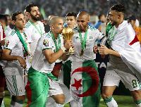 Algeria's Sofian Feghouli kissing the trophy