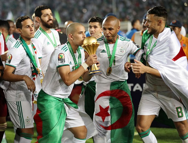 Algeria's Sofian Feghouli kissing the trophy