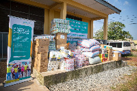 The donated items include bottled water, bags of rice tins of milk and other provisions