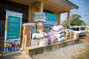 The donated items include bottled water, bags of rice tins of milk and other provisions