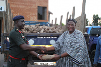 Chief Jawara making the presentation to Captain Asamoah