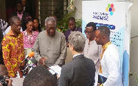 Ex president J A Kufuor with executives of millenium promise