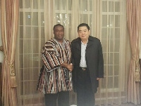 Mr Ankrah in a handshake with Prof Guoqing