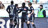 Ibrahim Mustapha (second right) congratulated by teammates