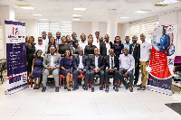 Mr Robert Nii Aryee Tackie in a pose with management of Makers and Partners, and participants