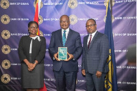 Governor of the Bank of Ghana, Dr. Ernest Addison, flanked by his deputies