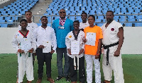 Dr. Kwamena Minta Nyarku with the taekwondoins from his region