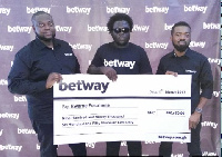 Kwame Fosuhene [C] receiving a cheque in 2017