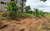 A part of the land behind the staff quarters encroached