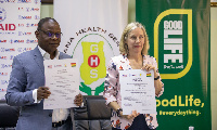 Dr. Patrick Kuma-Aboagye and Kimberly Rosen at the signing ceremony in Accra