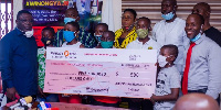 Joseph Awinongya Jr presented $500 to the Motherly Love Foundation