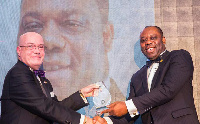 Ambassador Robert Porter Jackson presenting the award to Matthew Opoku Prempeh