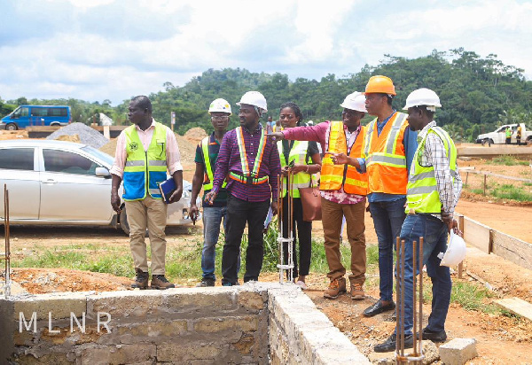 Benito Owusu-Bio being briefed by the contractors