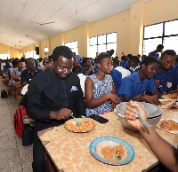 Reverend John Ntim Fordjour dining with the students