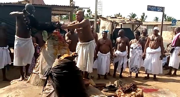 Aflao traditional priests offering sacrifice to deities of the land