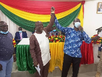 The elected MCE for Prestea Huni-Valley, Dr Isaac Dasmani (L)