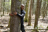 Abubakar Tahiru hugging a tree