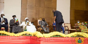 A photo of Mahama bowing to President Akufo-Addo