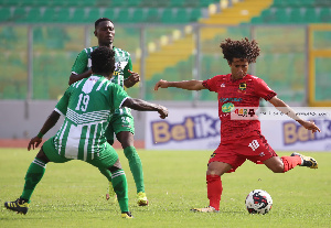 Asante Kotoko midfielder, Fabio Gama(Red) in action against King Faisal