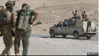 Men dressed in Iraqi federal police uniforms