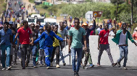 Angry protests against foreigners followed the killing of the police officer