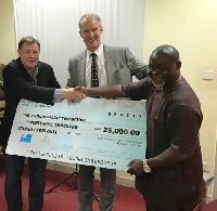 Australian High Commissioner Andrew Barnes presenting cheques to GOC and Azumah