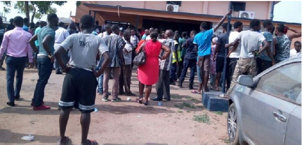 Angry mob besieging a police station