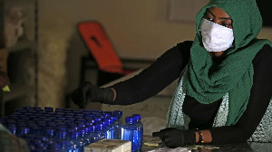 A Sudanese medical laboratory student prepare sterilisers to combat the spread of Covid-19