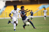 Accra Lions midfielder Oliver Amedor in a tussle with Black Meteors defender