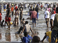 Hundreds thronged the beach the mark the holiday