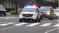 A photo of some cars with a siren