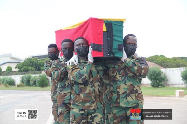 Soldiers carrying the mortal remains of the late Sani Victor Kwaku