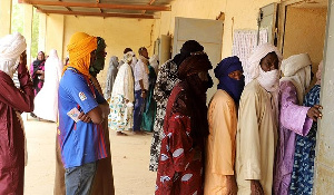 Voters stand in queue at a polling station in Gao, Mali