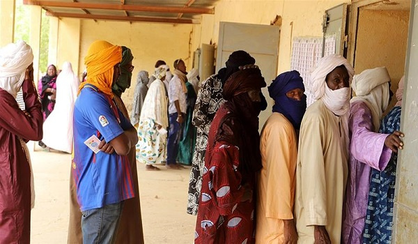 Voters stand in queue at a polling station in Gao, Mali